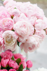 Lovely flowers in glass vase. Beautiful bouquet of pink peonies . Floral composition, scene, daylight. Wallpaper