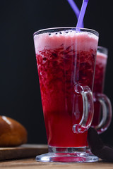 thick cherry drink mousse with foam on a dark background
