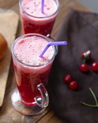 thick cherry mousse drink on a dark background