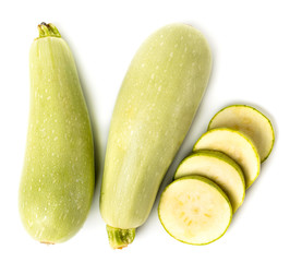 The zucchini and cut into rings on a white isolated. The view from the top.