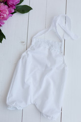 white baby bodysuit. clothes for the baby. children's clothes. white suit on newborn