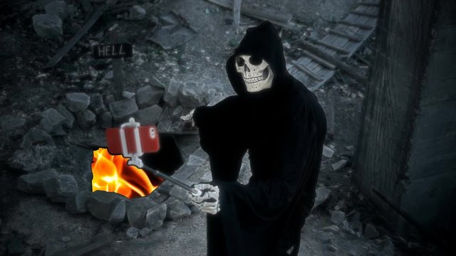 death with a scythe makes selfie on the background of the entrance to hell