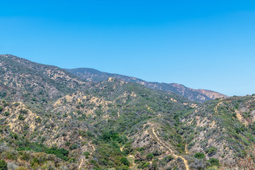 Fototapeta na wymiar Hiking and biking trails cover California mountains on clear summer morning