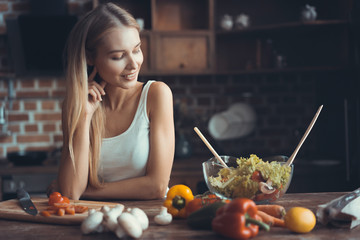 Young Woman Cooking. Healthy Food - Vegetable Salad. Diet. Dieting Concept. Healthy Lifestyle. Cooking At Home. Prepare Food.