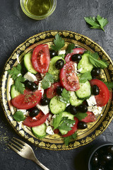 Vegetable salad with feta cheese - traditional dish of greek cuisine.Top view .