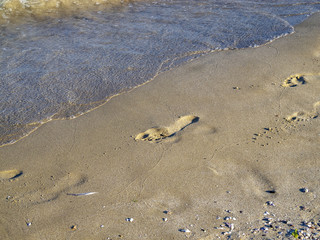 Footsteps in the sand of a Bulgarian Black Sea beach