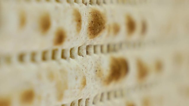 Passover or Pesach matzah is a traditional jewish holiday bread for passover. Pesach celebration symbol. Vertical format video.