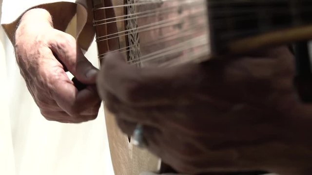 Close up, person plating guitar