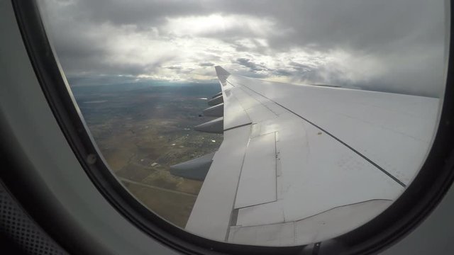 POV view of cloudy sky from plane window