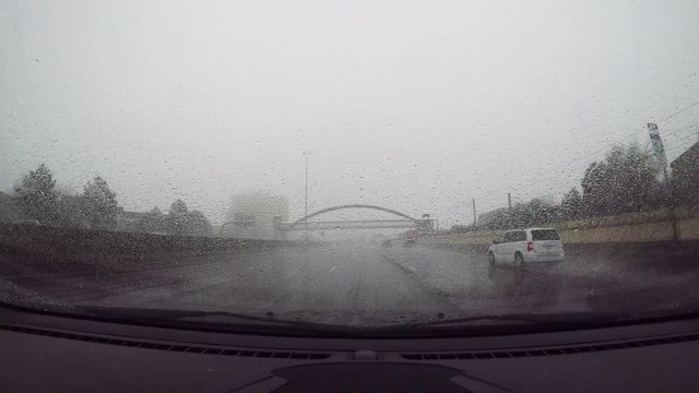 POV drive on highway in rain storm