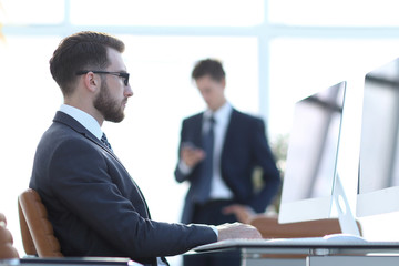 serious businessman sitting at his Desk