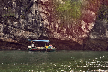 Fishing boat in Ha long Bay, Panoramic view of sunset in Halong Bay, Vietnam, Southeast Asia,UNESCO World Heritage Site