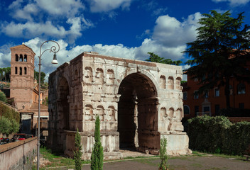 Fototapeta na wymiar The so called Arch of Janus ruins with clouds in the historic center of Rome