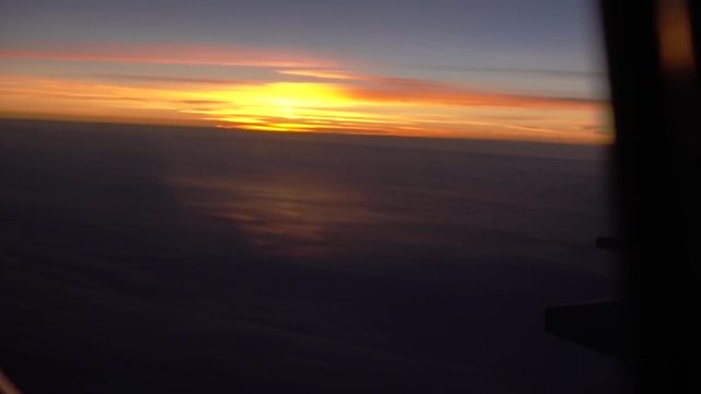POV shot, view of horizon on the plane window