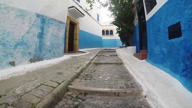 POV blue alleyways of Chefchaouen, Morocco