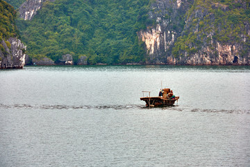 Halong bay boats,Sunset at Ha Long Bay scenic view , Hanoi, Vietnam