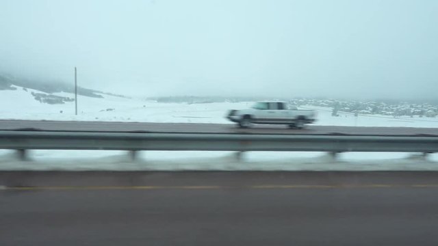POV driving on snowy Echo Canyon highway
