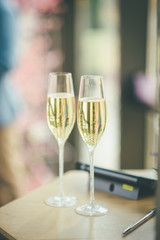 blurred glasses of champagne for newlyweds