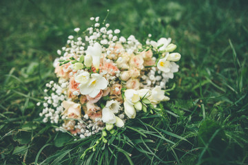wedding bouquet lying on the green grass