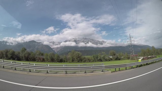 POV, driving past mountain landscape in Colorado