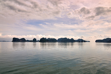 Naklejka na ściany i meble Halong bay boats, Vietnam Panoramic view of sunset in Halong Bay, Vietnam, Southeast Asia,UNESCO World Heritage Site