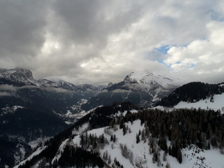 drone flying top view of  alps on bad weather  winter day