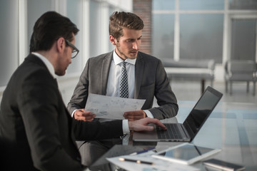 employees discussing financial data