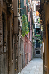 Fototapeta na wymiar Narrow street in Venice Italy 