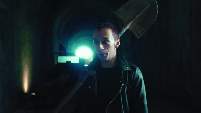 Crazy maniac psychopathic singing and striking with a shovel.Psicopathy,violence