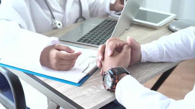 Healthcare medical concept. Doctor 
Explain and recommenced to patient listening receiving prescriptions medicine with prescription clipboard record paper in doctor's office