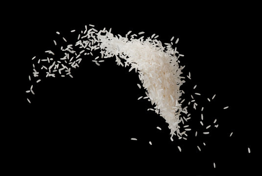 Stop motion white rice splash or explode flying in the air  isolated on black background food object design