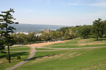 Fototapeta premium Woman walking on a road on a sunny day