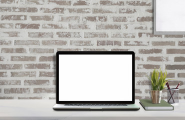 Mock up workspace with blank screen laptop and mockup poster