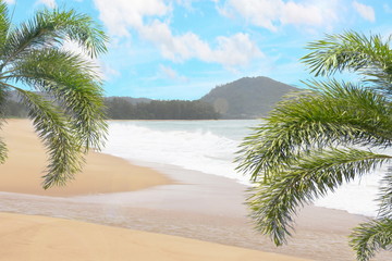 Beautiful sea beach mountain cloudy with frame by coconut or palm leaf and bluesky background