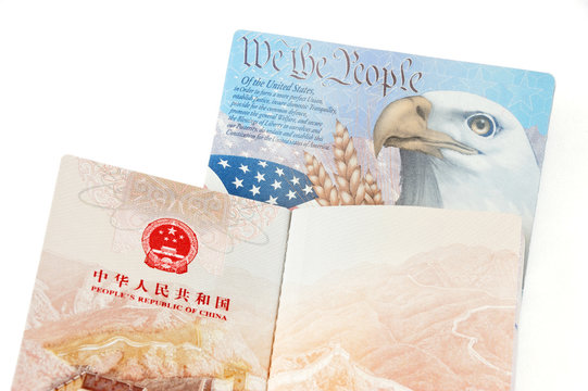 open passports of China and USA isolated on white background