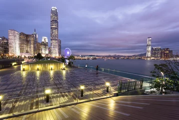 Fototapeten Stunning sunset view of the Central business district in Hong Kong island from the waterfront promenade along the Victoria harbor in Hong Kong, China © jakartatravel
