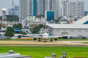 Passenger airplane taxiing on runway