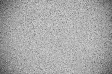 Concrete texture background for background in black and soft vignette, grey and white colors and solid point.