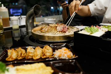 Pork grill on BBQ brass pan.