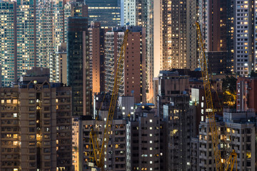 Fototapeta na wymiar Very high density of apartment towers in the Happy Valley district of Hong Kong island at night in China SAR.