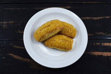 crispy shortbread cookie lies a saucer on the table