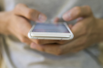 hands with mobile phone in the foreground