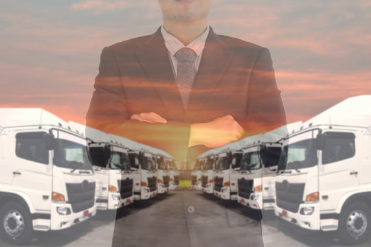 Double exposure of business man with Haulage trucking fleet as in trucking manager.