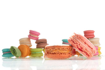 Colorful french macarons on white background.