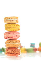 Colorful french macarons on white background.
