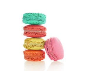 Colorful french macarons on white background.