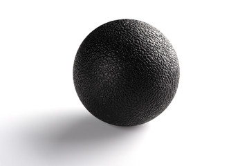 black massage ball on white background