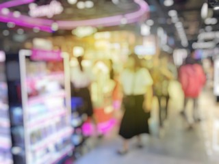 Abstract background of blurred image of people in shopping mall with bokeh. Vintage tone. for background usage