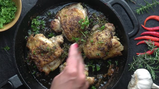 Cast Iron Chicken Thighs. Grilled to perfection and garnished with Parsley. 