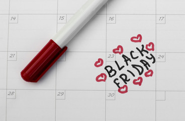 inscription Black Friday on calendar and red marker.